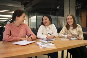 front view women correcting grammar mistakes